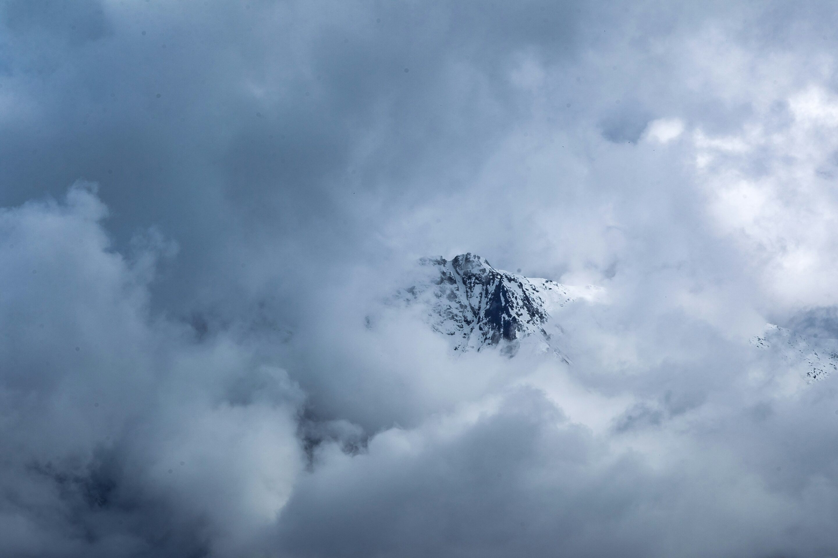 Business Recovery South Africa photo of top of mountain showing through clouds