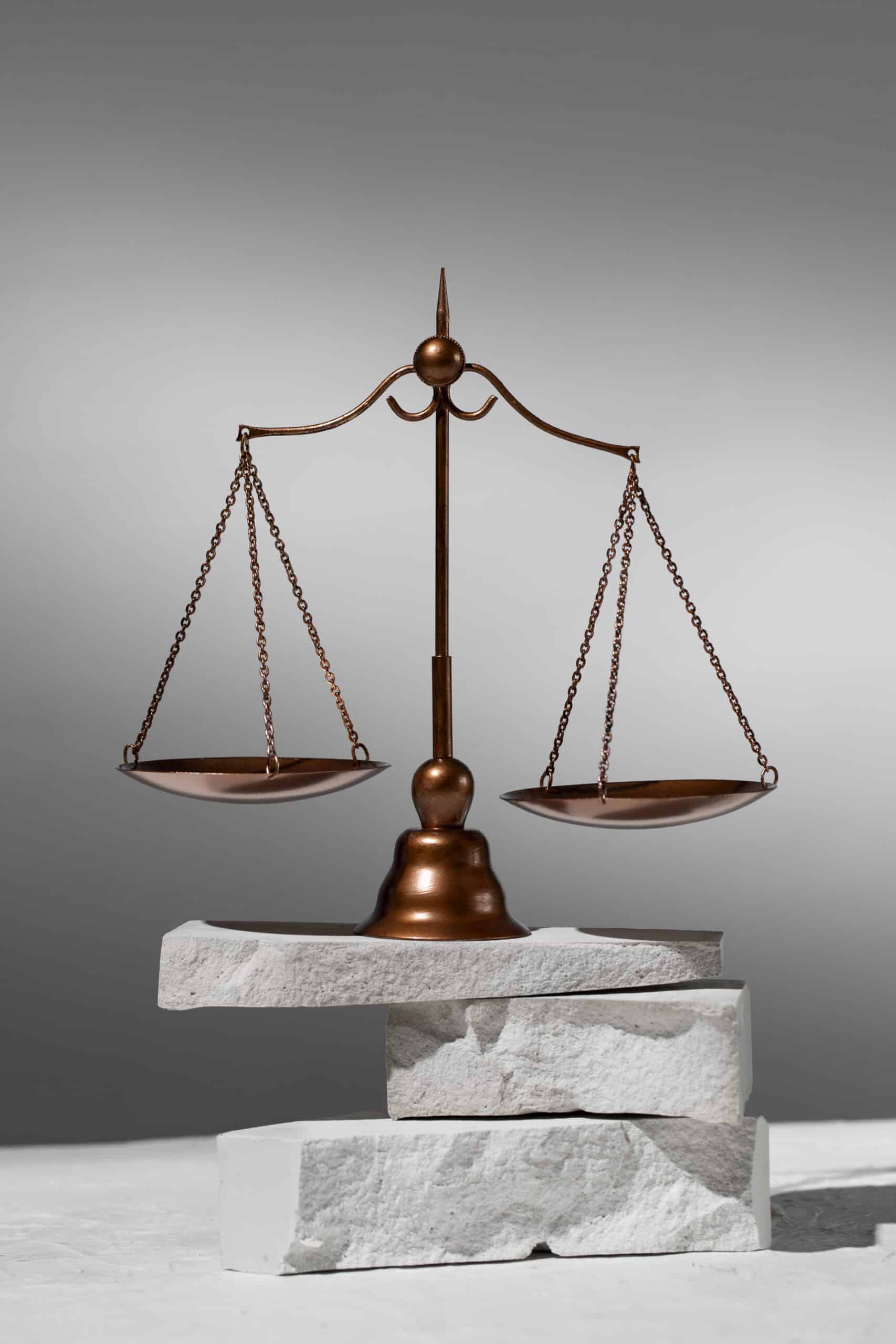 Contractor versus employee status photo of scales of justice
