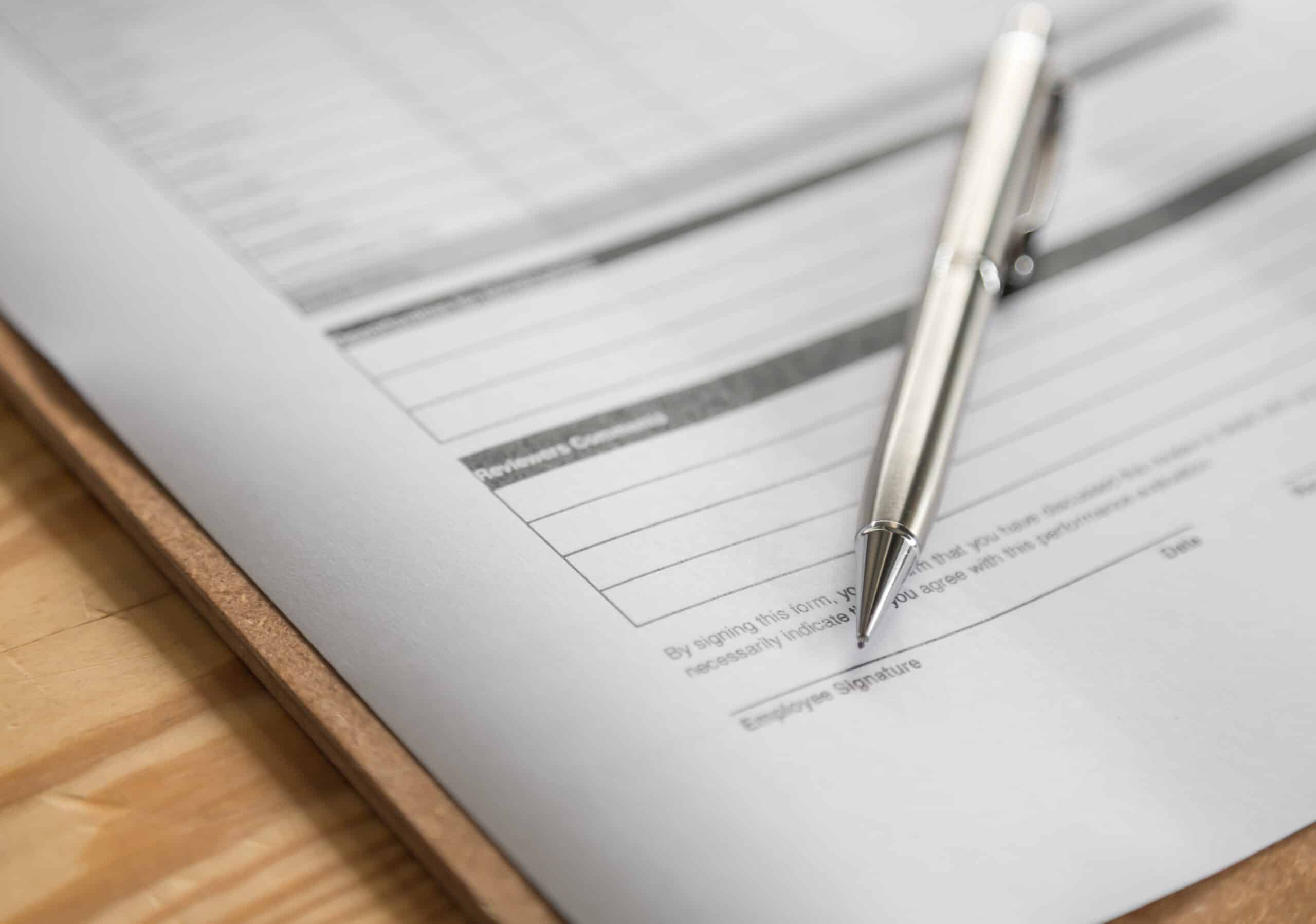 Tax Representative South Africa photo of professional document with pen lying on top of document