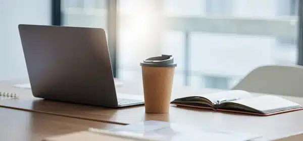 South Africa Business Setup photo of desk with laptop and coffee