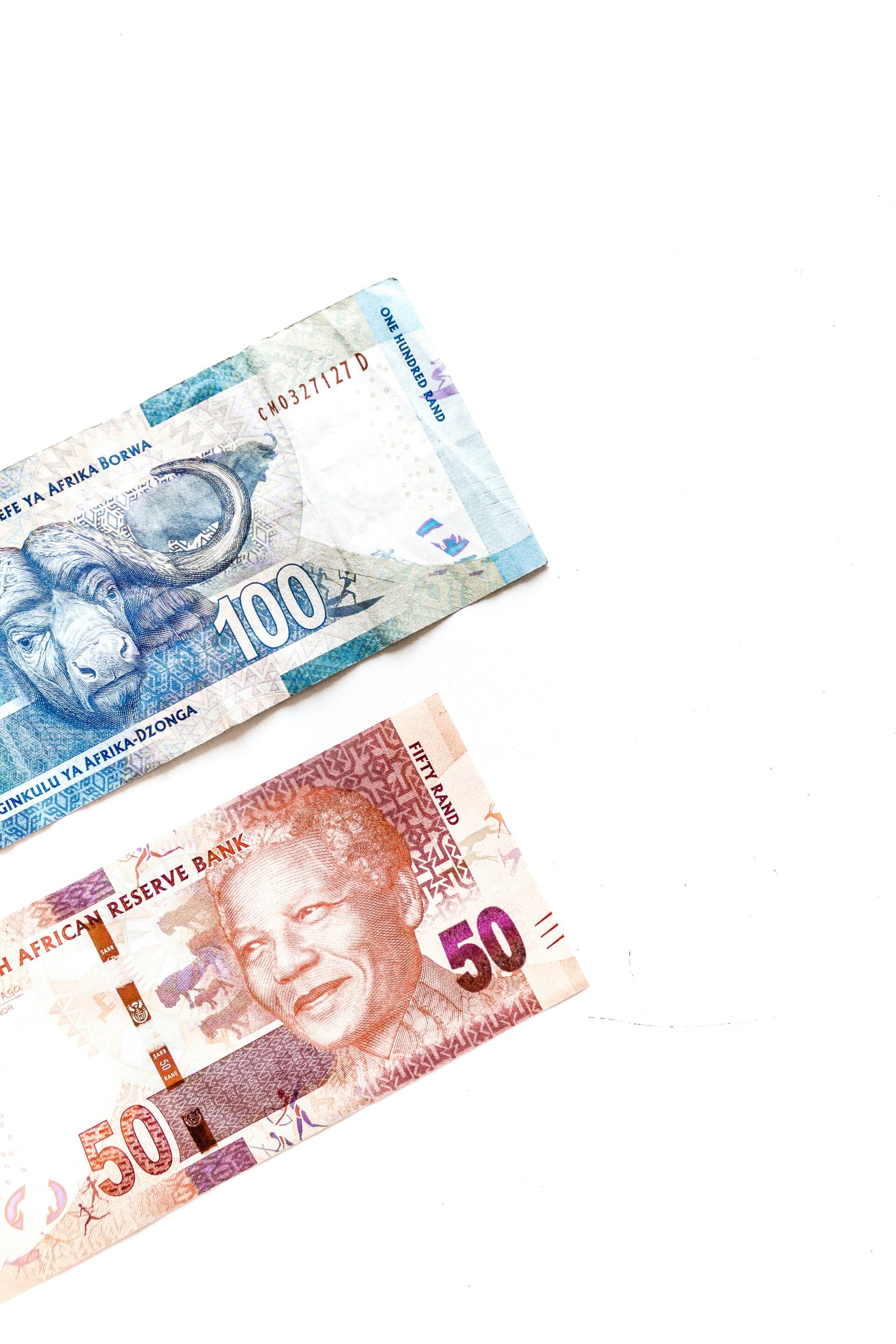 Double Tax Agreement Explained photo of a R50 and R100 south african notes displayed over white background
